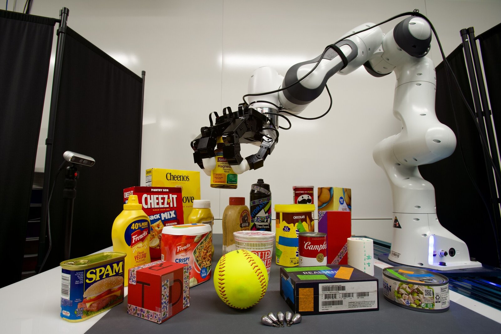 Hardware setup: a 7-DOF Franka arm with a 16-DOF Allegro hand, a camera, and household objects.